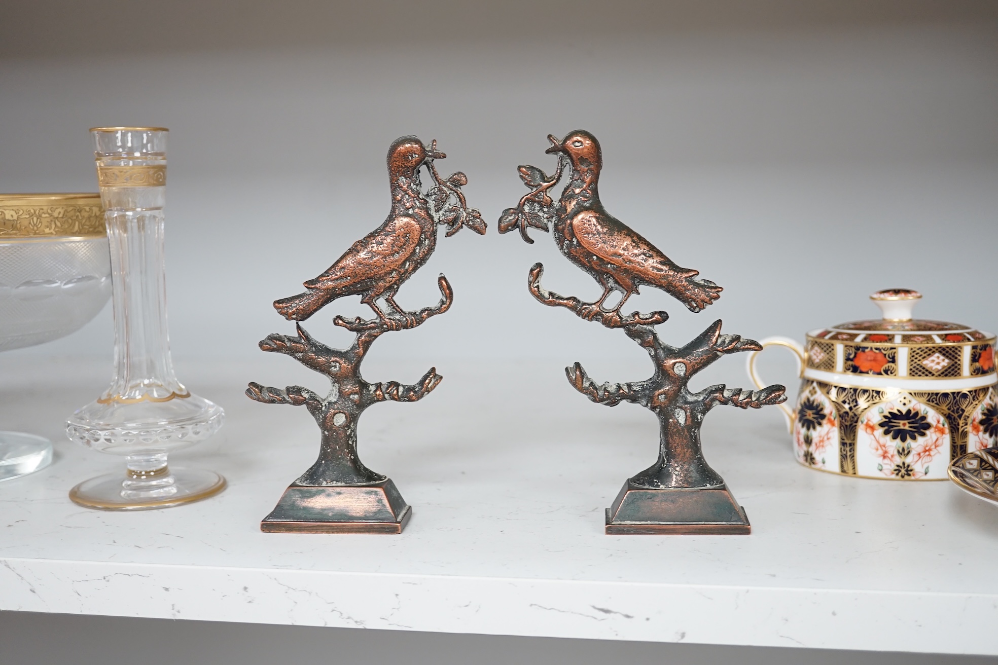 A pair of Victorian cast bronze bookends, formed as doves of peace, 17cm high. Condition - fair to good.